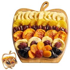 a wooden platter filled with lots of different types of fruit