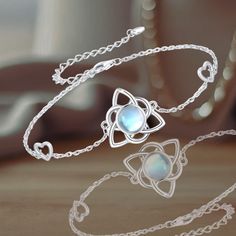 This Celtic Knot bracelet features a beautiful moonstone that symbolizes love and friendship. The intricate knot represents eternal loyalty, faith, and devotion, making it a timeless piece.  Made from high-quality sterling silver, this bracelet is hypoallergenic and nickel-free, ensuring it's comfortable for sensitive skin. The white gold plating adds durability and a lasting shine.  Bracelet is adjustable (7+2 inches) with a 3mm moonstone. Elegant and lightweight for daily wear. Perfect gift fo Celtic Knot Bracelet, Irish Jewelry, Gifts Fo, Moonstone Bracelet, Knot Bracelet, Celtic Knot, Charm Bracelets, Timeless Pieces, Good Luck