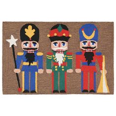 three nutcrackers are standing next to each other on a door mat with a star