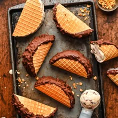 chocolate waffles with ice cream and nuts on a baking sheet, ready to be eaten