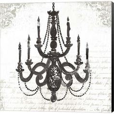 an old fashioned chandelier hanging from the ceiling in front of a piece of paper with writing on it