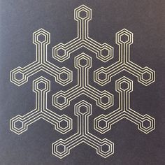 an image of a snowflake made out of white lines on black paper,