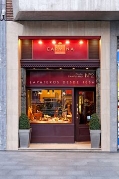 the storefront of a restaurant called carmina