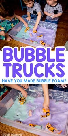 two children playing with bubble trucks in a plastic container on the floor and text overlay that reads, bubbles trucks have you made bubble foam?