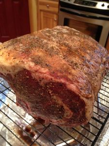 a large piece of meat sitting on top of a metal rack