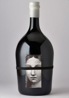 a bottle of wine with an image of a man's face on the label