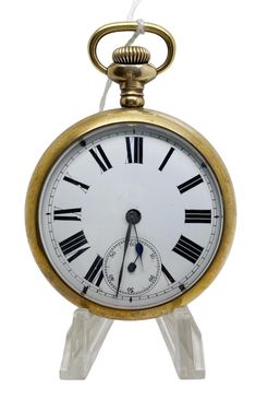 an antique pocket watch with roman numerals on it's face and hands