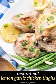 lemon garlic chicken thighs on a plate with green beans