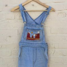 Levi’s Re-Worked Donna Martin / Mom Fit Overalls Hand Embroidered Desert Landscape Size 24 Great Condition Tapered Fit 100% Cotton Approx. Measurements Laying Flat: Waistband: 13” Hips: 17” Inseam: 26” Thighs: 8.5” Leg Opening: 5” Hand Embroidered By Myself, The Price Reflects The Many Hours I Spent Embroidering These :) Levis Overalls, Overalls Pants, Jean Overalls, Desert Landscape, Levis Women, Overalls Women, Jumpsuits For Women, Hand Embroidered, Levi's