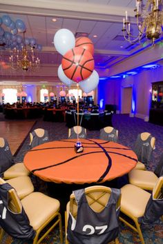 a basketball themed party with balloons and chairs