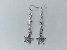 The earrings are decorated with star-shaped brass pendants. The earrings are fastened with stainless steel hookss. Earring length - 6.0 cm (2.4 inches) Earrings are packed in a gift box RECOMMENDATIONS FOR CARE: Do not wet, do not drop, and store in a dark box! - Remove jewelry before exercising, swimming, showering and sleeping. - Avoid contact with moisture such as make-up, moisturizer, lotion, perfume and hairspray. - Store your jewelry in a box or pouch after use. Grunge Metal Earrings Nickel Free, Grunge Silver Pierced Earrings, Nickel-free Metal Earrings In Grunge Style, Silver Pierced Grunge Earrings, Earring Y2k, Silver Grunge Pierced Earrings, Grunge Style Nickel-free Metal Earrings, Grunge Jewellery Earrings, Gothic Metal Earrings For Alternative Fashion