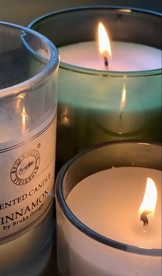 three candles sitting next to each other on a table