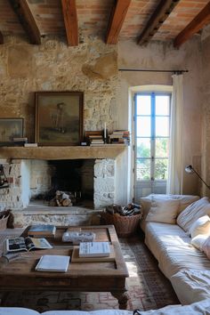 a living room filled with furniture and a fire place