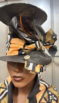 A touch of the Zulu Tribe . This is a tall hat that is sure to attract attention . It is raising the bar. It has african fabrics, leather , feathers and cowrie Shells. For more designs visit Evelyncreationinc @ etsy.com Do t delay order yours today. Black Bohemian Costume Hats And Headpieces, Bohemian Black Cap Hat, Bohemian Black Costume Hat With Short Brim, Bohemian Brown Top Hat For Festivals, Brown Bohemian Top Hat For Festival, Bohemian Black Cap, Bohemian Fitted Sun Hat With Short Brim, Fitted Bohemian Sun Hat With Short Brim, Bohemian Brown Short Brim Costume Hat