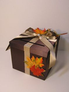 a brown box with autumn leaves on it