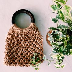 Macrame Handbag with Natural Wooden Handles Pura Vida Eco-friendly Macrame Straw Bag For Summer, Eco-friendly Brown Braided Crochet Bag, Natural Macrame Beach Bag For Everyday Use, Eco-friendly Macrame Beach Bag, Summer Macrame Beach Bag In Natural Color, Eco-friendly Macrame Straw Bag, Natural Macrame Beach Bag For Summer, Eco-friendly Natural Macrame Beach Bag, Natural Straw Bag With Macrame For Everyday Use