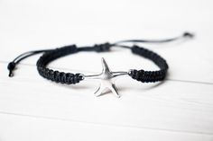 This bracelet has a Starfish silver tone connector, in a zinc alloy metal.  This bracelet is adjustable to ensure a great fit. Many colors to choose from. Photo shown is blue cotton cord.Sizes:Small (5.5 - 6.5 inches)Medium (6.5 - 7.5 inches)Large (7.5 - 8.5 inches)These charms are made from a zinc alloy metal which is lead and nickel free. Measurements: 24mm x 17mm*Avoid getting the bracelet wet to lengthen the life of your bracelet*Please review the listing description and feel free to ask any Silver Friendship Bracelets With Sliding Knot, Casual Silver Bracelets With Adjustable Cord, Casual Silver Bracelet With Adjustable Cord, Adjustable Casual Jewelry With Starfish Charm, Adjustable Silver Charm Bracelet With Starfish, Casual Starfish Charm Jewelry, Nickel-free Silver Braided Bracelets, Adjustable Starfish Casual Bracelets, Adjustable Starfish Charm Bracelet Gift