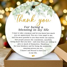 thank you for being a blessing ornament in a gift box with lights behind it