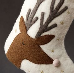 a close up of a stuffed animal with antlers on it's head and nose