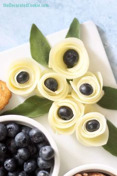 some blueberries and other food items on a white plate