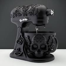 a black mixer with a skull design on it