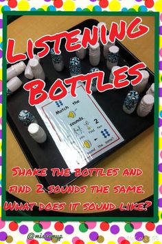 a black tray topped with lots of bottles next to a sign that says listening bottles