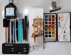 the contents of an artist's kit including pens, pencils and markers are neatly organized