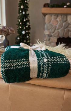 a pair of green towels sitting on top of a couch