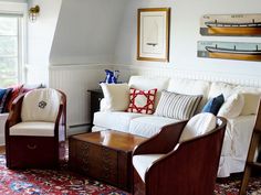 a living room filled with furniture and a ladder