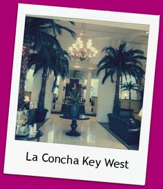 the lobby is decorated with palm trees and chandelier