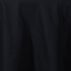 the back side of a black jacket with buttons and zippers on it, showing an open