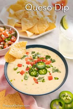 quesadilla dip in a bowl with chips and salsa on the side