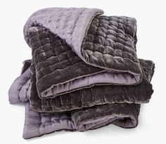 three blankets stacked on top of each other