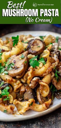 pasta with mushrooms and parsley on a white plate