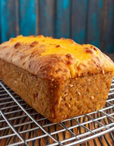 a loaf of bread sitting on top of a cooling rack