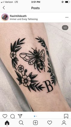 a black and white photo of a bee with flowers on it's leg that reads b