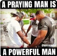 two men are talking to each other in front of a sign that says, a praying man is a powerful man