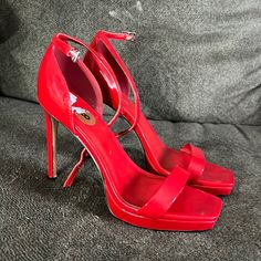 Worn Once. New Without Tags. Red Synthetic Heels With 4-inch Heel, Red High Heels With Heel Strap, Red Synthetic Open Heel Heels, Red Platform Heels With Open Heel, Red Open Heel Shoes With 4-inch Heel, Red Heels With 4-inch Open Heel, Red Open Heel 4-inch Heels, Chic Red Platform Heels, Red Open Heel Heels With 4-inch Heel