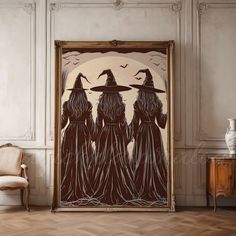 three witches standing in front of a painting on the wall