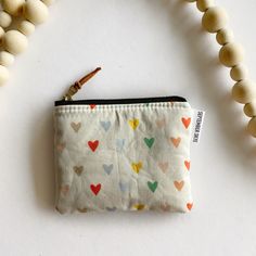 "Stash your odds and ends with this adorable square mini zipped pouch! As beautiful as it is functional, these bags are perfect for travel or everyday use! A mini first aid kit, a manicure set, jewelry holder or small makeup bag - it can be used for any organizational purpose!  Buy it for yourself or as a thoughtful gift to a friend or a family member! Makes a great gift paired with a gift card holder.  Specs: Approx 5\"x4\" Metall ykk zipper  Zipper is accented with a leather pull tag Lined wit Mini First Aid Kit, Mini Makeup Bag, Small Makeup Bag, Mini Makeup, Basket Fillers, Mini Pouches, Manicure Set, Leather Pulls, Jewelry Holder