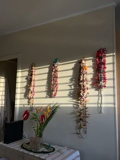 the wall is decorated with flowers and garlands