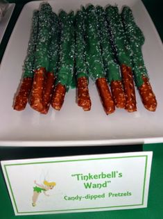 there are many candy - dipped pretzels on the plate and one is for tinkerbell's wands