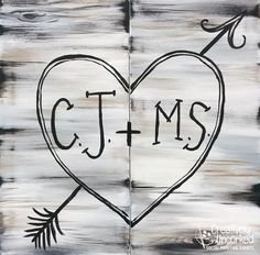 a heart with an arrow and the word ct & ms painted on it in black ink