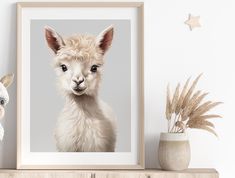 a white llama standing next to a potted plant on top of a wooden shelf