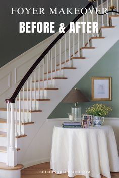 a white table sitting under a stair case next to a bannister with pictures on it