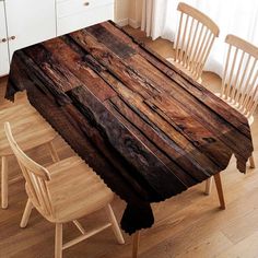 a wooden table with chairs around it