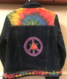 a jacket with a peace sign painted on it