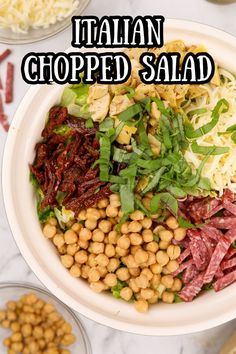 a bowl filled with meat and vegetables next to other bowls full of pasta, lettuce and beans