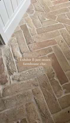 an image of a brick floor with the words, eibitt b just oozes farmhousehouse chic