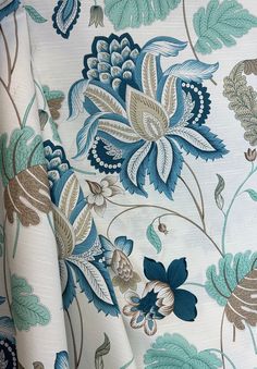 a blue and brown floral pattern on white fabric